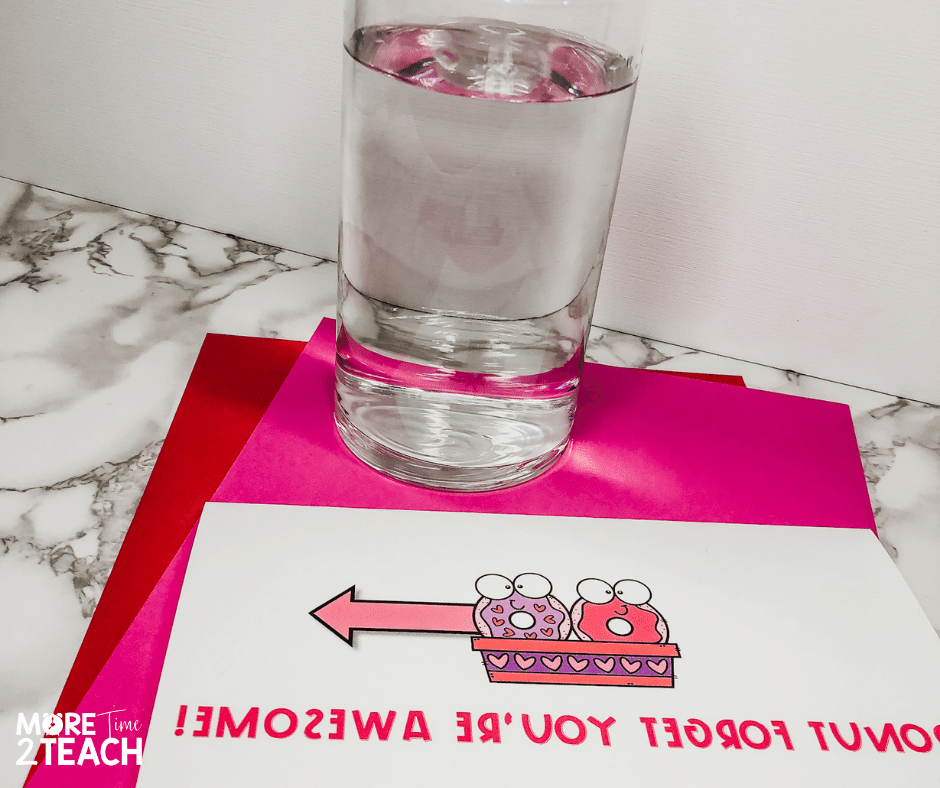 Try this simple light refraction experiment  perfect for Valentine's Day. Help kids see how light bending or refracting helps them read a secret Valentine message. Perfect for an easy science experiment!